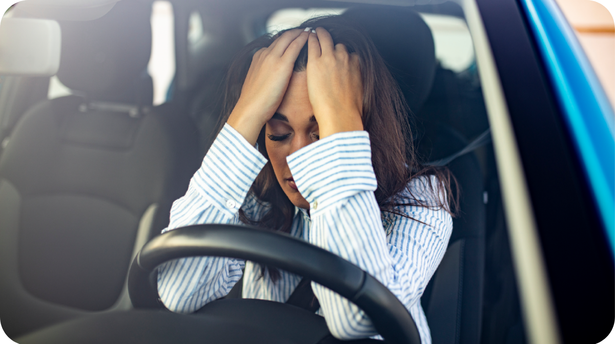 unhappy woman in a car